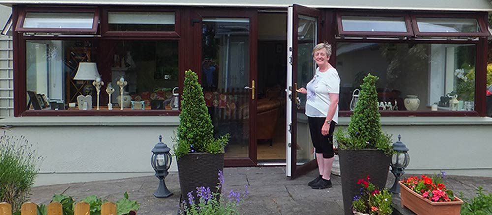 Castleview-welcome Liz holding the door open towelcoming you to Castleview B&B