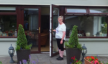 Liz opens the door at Castleview B&B